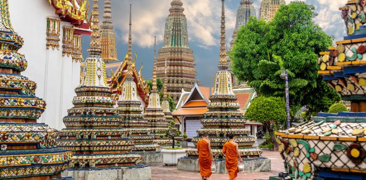 two-monks-walking-alongside-stupas-at-the-wat-pho-temple-in-bangkok-3